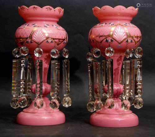 Pair of pink glass table lustres with gilded and painted floral decoration, 40cm high