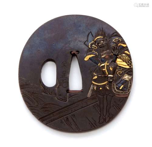 19th century Japanese oval iron Tsuba, decorated in gold with a warrior on horseback with battle