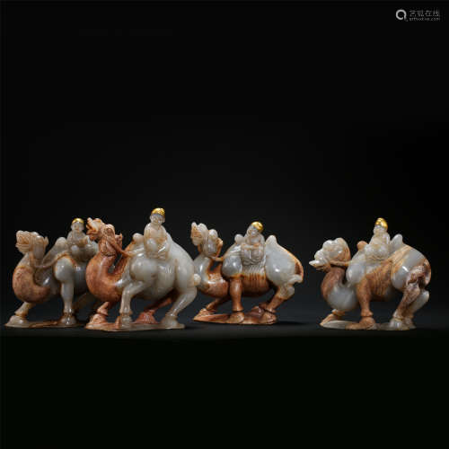 FOUR CHINESE PARTLY GILT JADE MEN ON CAMEL TABLE ITEMS