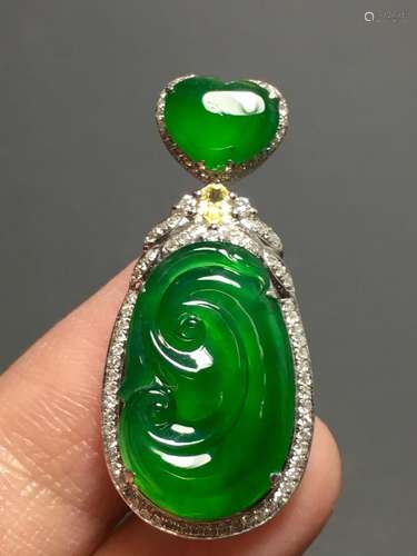 A GREEN JADEITE CARVED AUSPICIOUS PENDANT, TYPE A