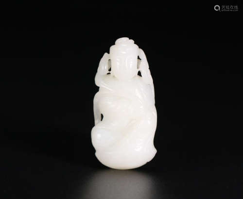 A HETIAN JADE CARVED SAKYAMUNI SHAPED PENDANT