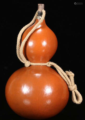 A GOURD CARVED WINE HOLDER