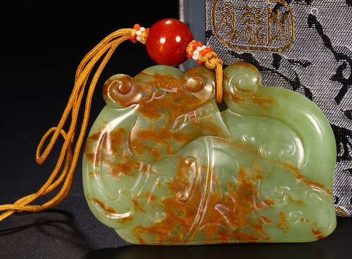 A HETIAN JADE CARVED TIGER PATTERN PENDANT