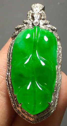 A GREEN JADEITE CARVED LEAF PENDANT, TYPE A