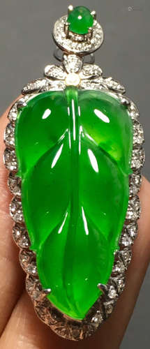 A GREEN JADEITE CARVED LEAF PENDANT, TYPE A