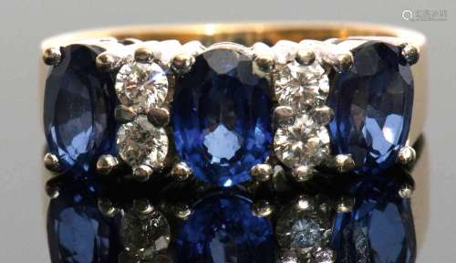 Sapphire and diamond half-hoop ring, the three oval shaped faceted sapphires, 0.90ct each (est),