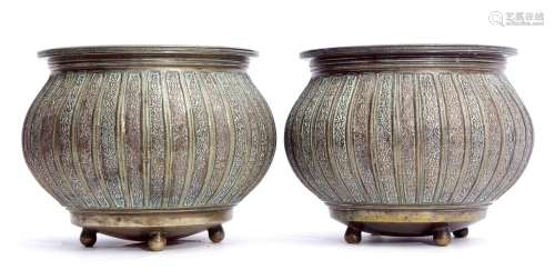 Pair of decorative gilt metal planters of compressed circular baluster form, the rims and sides