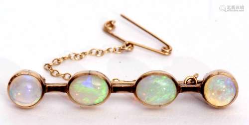 Opal bar brooch featuring two oval and two circular shaped cabochon opals, each collet set, 4.5cm