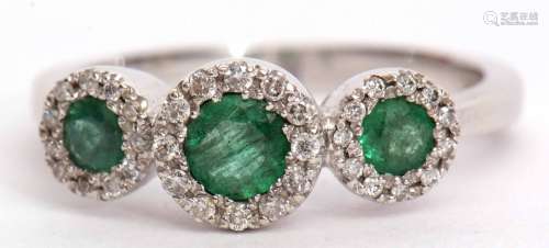 Triple emerald and diamond cluster ring featuring three graduated emeralds, 0.66ct weight approx,