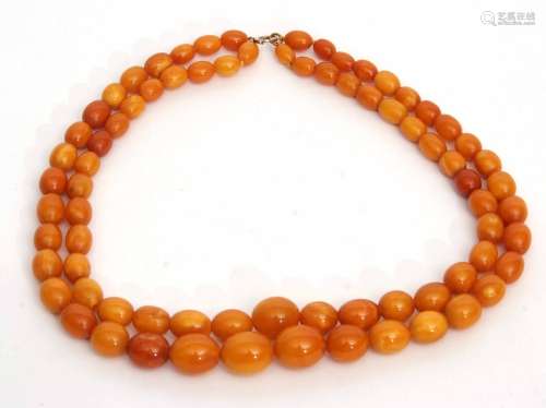 Amber bead double string necklace of graduated form, 9mm to 15mm, 40.7gms