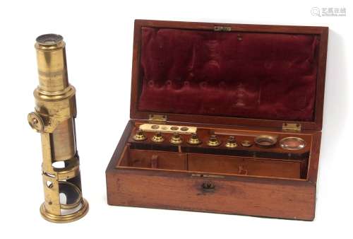 Mid-19th century rosewood cased lacquered brass drum microscope of typical form with screw adjusting