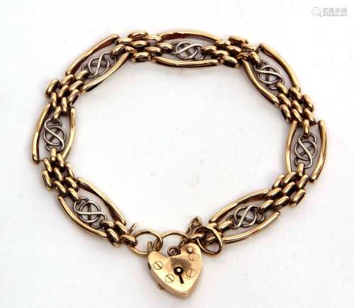 Two-tone 9ct gold pierced panelled bracelet, featuring a heart padlock and safety chain fitting,