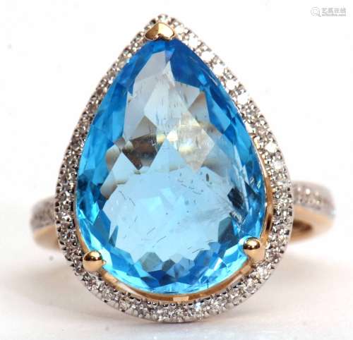 Modern blue topaz and diamond cluster ring, set with a pear cut blue topaz, 11.49ct (est), within