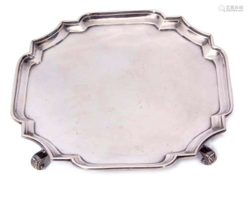 Edward VII salver of polished form with applied rim with shaped corners and raised on four cast