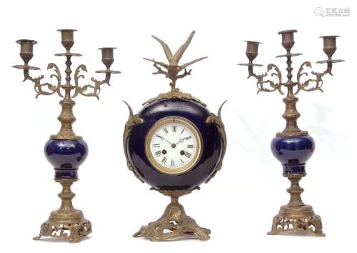 Late 19th/early 20th century cast brass and porcelain mounted clock garniture, the circular cobalt