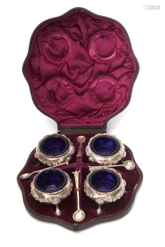 Cased Victorian set of four cauldron salts, each with flared rims and chased and embossed floral