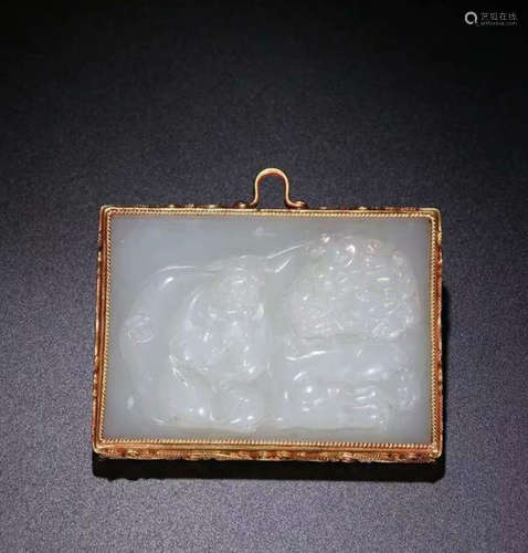 A HETIAN JADE PENDANT WRAPPED IN SILVER