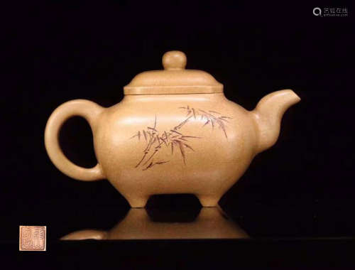 A ZISHA TEAPOT CARVED IN BAMBOO