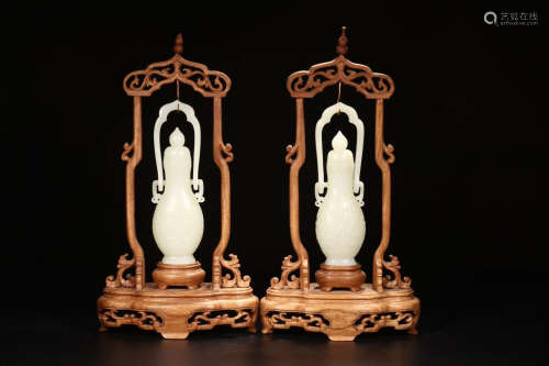 A PAIR OF HETIAN JADE VASES WITH BASES