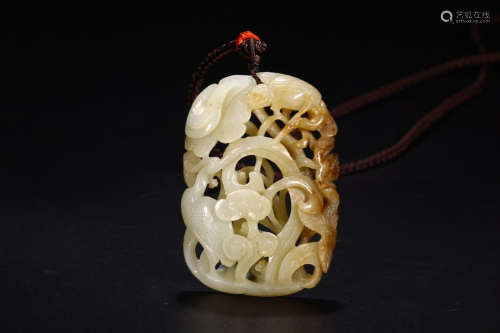 A HETIAN JADE HOLLOWED-OUT ANIMAL PENDANT