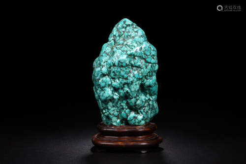 A TURQUOISE STONE ORNAMENT