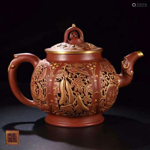 A ZISHA HALLOWED-OUT GOLD PAINTED TEAPOT