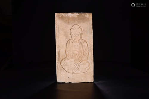 A TEMPLE BRICK ORNAMENT CARVED IN A BUDDHA