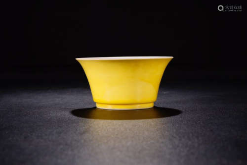 A YELLOW GLAZED HORSE-HOOF CUP IN DRAGON LINES