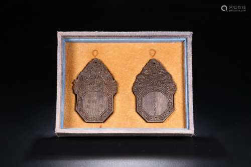A PAIR OF CHENXIANG WOOD CARVED PATTERN TABLETS