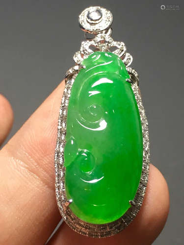 A GREEN JADEITE CARVED 