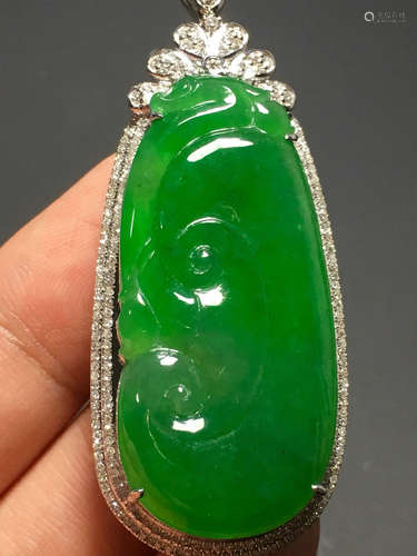 A GREEN JADEITE CARVED 