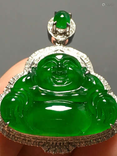 A GREEN JADEITE CARVED BUDDHA FIGUREPENDANT