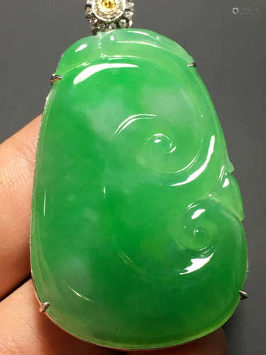 A GREEN JADEITE CARVED 