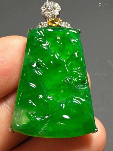 A GREEN JADEITE CARVED LANDSCAPE PENDANT