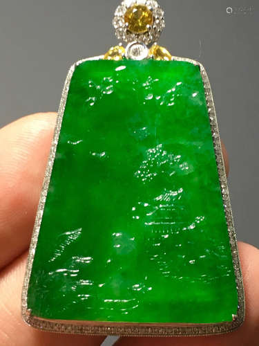 A GREEN JADEITE CARVED LANDSCAPE PENDANT