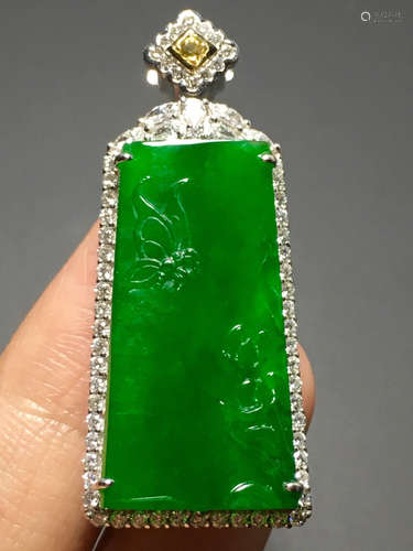 A GREEN JADEITE CARVED LANDSCAPE PENDANT