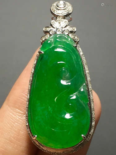 A GREEN JADEITE CARVED 