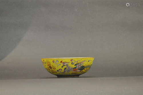 CHINESE PORCELAIN YELLOW GLAZE FAMILLE ROSE DRAGON AND PHOENIX BOWL