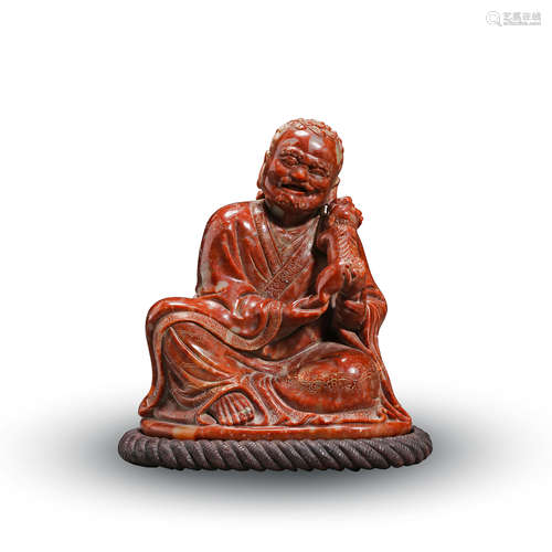 CHINESE RED SOAPSTONE SEATED LOHAN TABLE ITEM