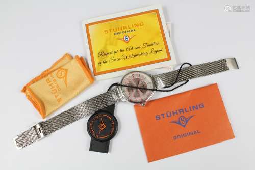 A Gentleman's Stuhrling Stainless Steel Wrist Watch, complete with original paperwork and guarantee card