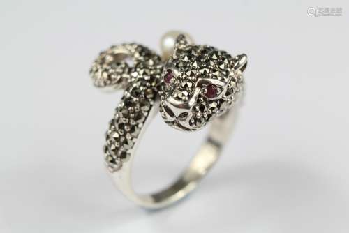 A Silver Cartier-style Ring; the ring in the form of a panther, set with a single pearl and ruby eyes, size T