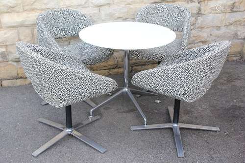 The 'Orange Box Company' Melamine Table and Chairs; the round table, approx 80 dia x 73 cms h, on central metal support covered in black and white patterned fabric, together with four matching chairs also on metal supports