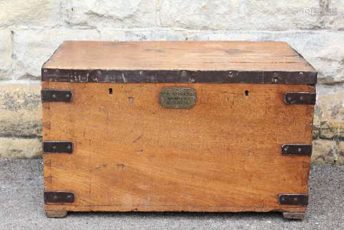 An Oak Military Trunk; the trunk has metal banding and carry handles to sides, plaque to front reads 