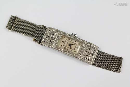 A Lady's Art Deco Cartier 18ct Gold and Diamond Lady's Cocktail Watch; manual wind, circa 1930's, with champagne face and numeric dial, mesh bracelet, the face measures approx 20 x 10 mm