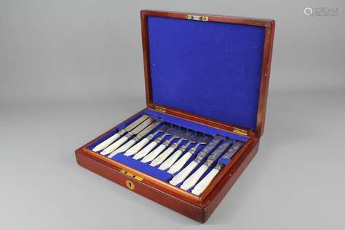 A Set of Twelve Mother of Pearl and Silver Victorian Fruit Knives and Forks, Birmingham hallmark, dated 1871, mm John Gilbert, housed in the original box