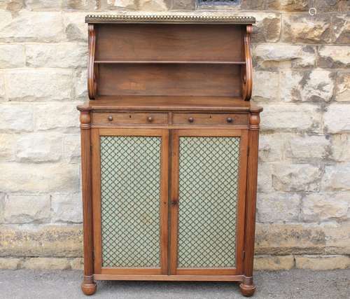 Fine Regency Period Small-size Mahogany Rosewood Chiffonier; with two-tier back, the top tier with brass gallery supported by 'S' shaped supports with two drawers to frieze and cupboards under with brass grill doors flanked by fluted columns, standing on bun feet