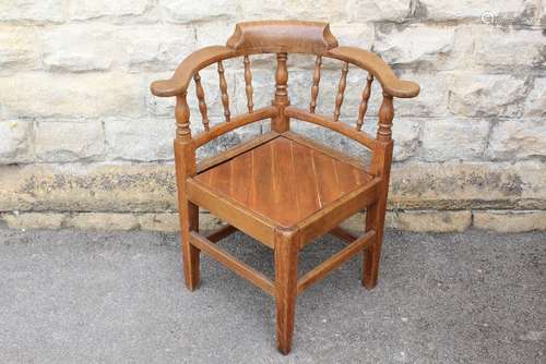 An Arts & Crafts Oak Corner Chair, with planked pine seat