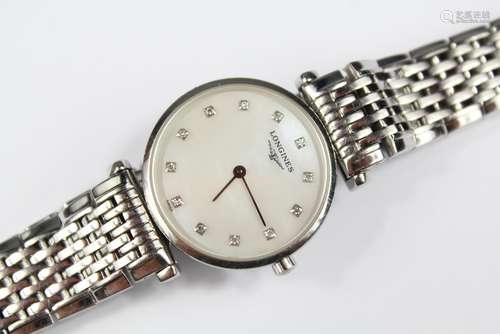 A Lady's Longines La Grand Classique Stainless Steel Bracelet Watch, the watch having a white enamel face with diamond batons, on the original Longines bracelet