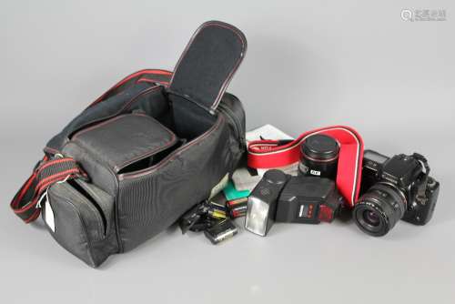 A Canon EOS 10 Camera; the Canon Zoom Lens  EF 35-70 mm 1:3