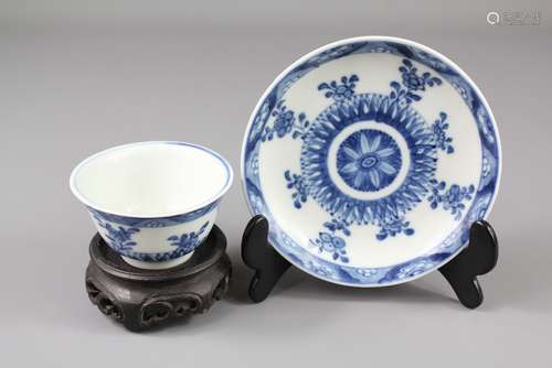 18th Century Chinese Blue and White Tea Bowl and Saucer, hand painted with peony, the base with double circle enclosing a blossom